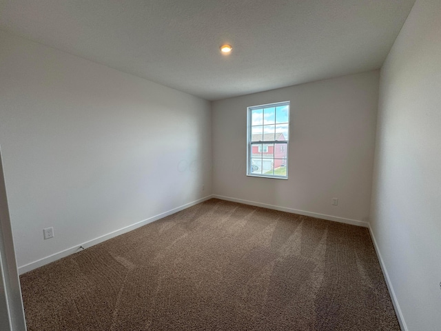 empty room with carpet flooring