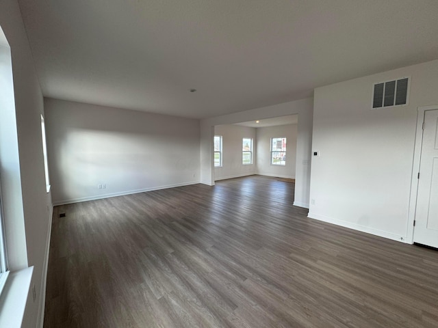 unfurnished room featuring dark hardwood / wood-style flooring