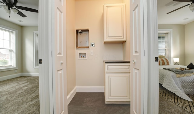 laundry room featuring hookup for an electric dryer, hookup for a washing machine, dark colored carpet, and cabinets