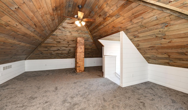 bonus room with carpet floors, vaulted ceiling, wooden walls, and wood ceiling