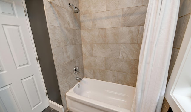 bathroom featuring shower / bath combo with shower curtain