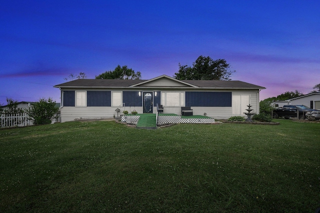 ranch-style house featuring a yard