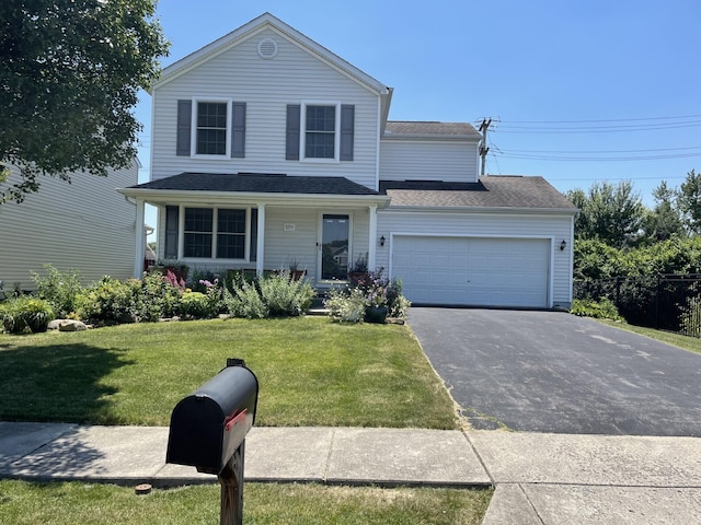 front facade featuring a front yard and a garage