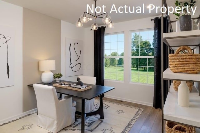 office space featuring hardwood / wood-style flooring, an inviting chandelier, and a wealth of natural light