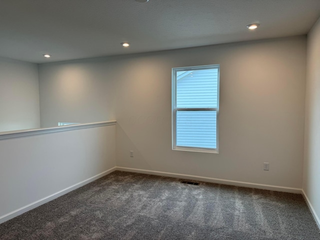 empty room featuring carpet flooring