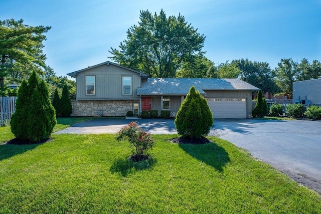 view of front of house with a front lawn and a garage