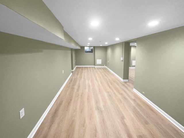 basement featuring light wood-type flooring