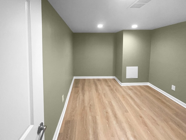 unfurnished room featuring light hardwood / wood-style flooring