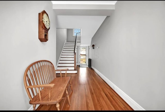 staircase featuring hardwood / wood-style flooring