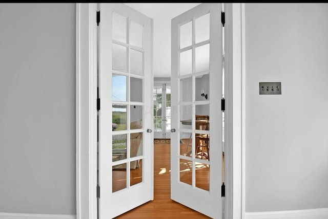 doorway featuring french doors and light wood-type flooring