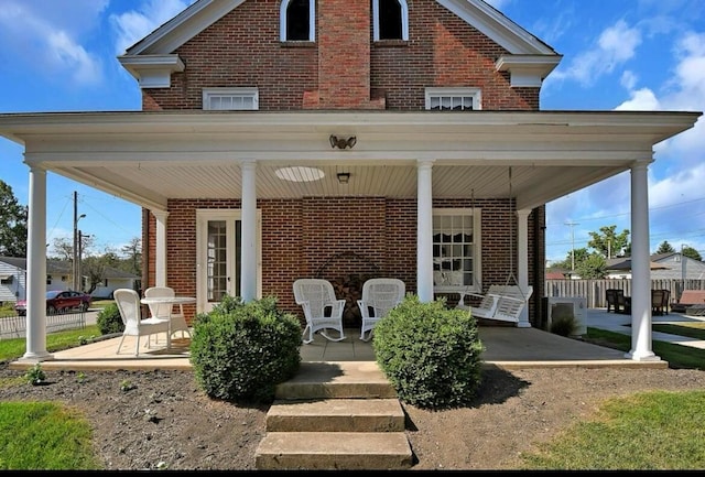 back of property featuring a porch