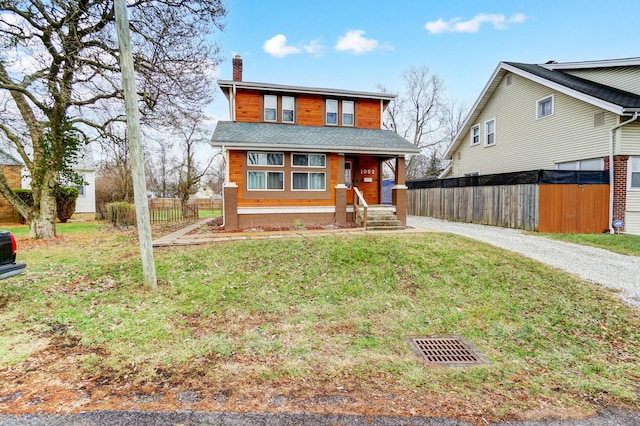 front of property featuring a front yard and a porch