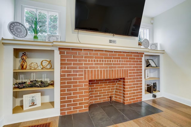 interior details with hardwood / wood-style floors and built in features