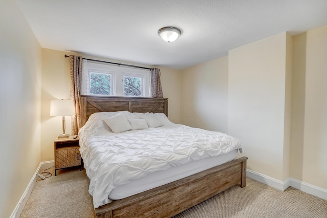 bedroom with light colored carpet