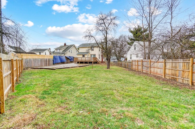 view of yard featuring a wooden deck