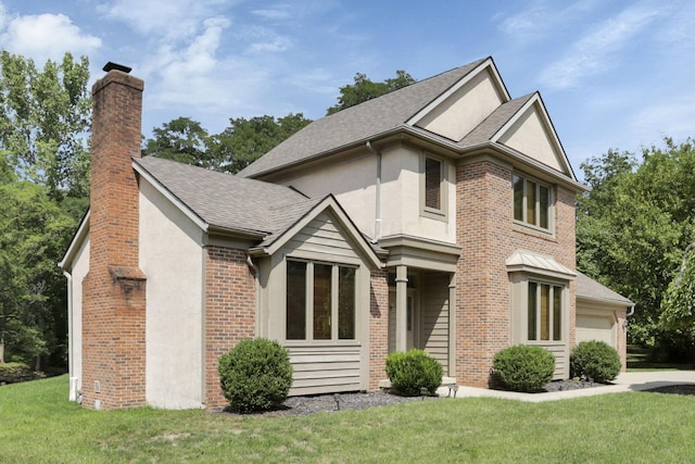 view of front of house with a front yard and a garage