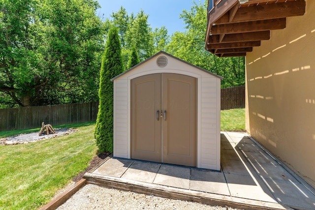 view of outdoor structure featuring a lawn