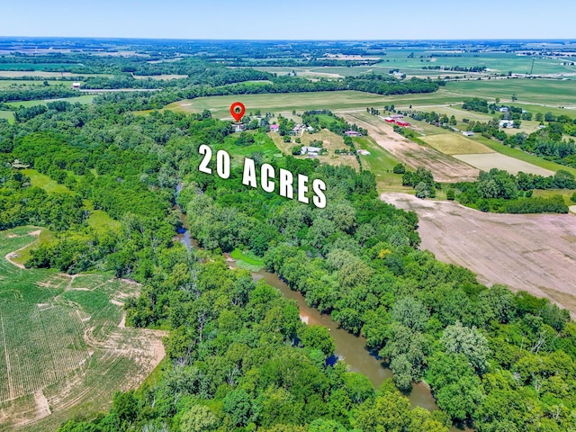 drone / aerial view featuring a rural view and a water view