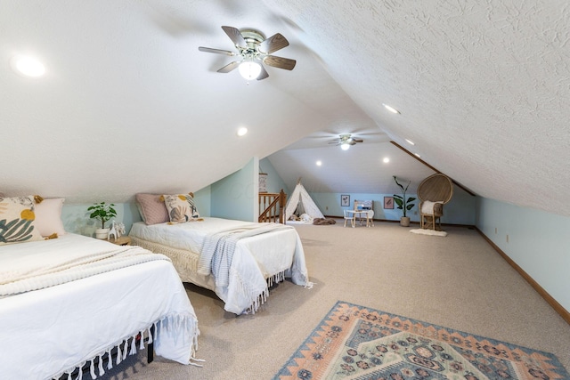 carpeted bedroom with ceiling fan, lofted ceiling, and a textured ceiling