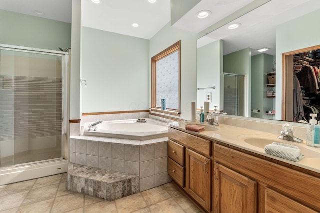 bathroom featuring vanity and plus walk in shower