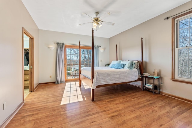 bedroom with access to exterior, light hardwood / wood-style floors, and ceiling fan