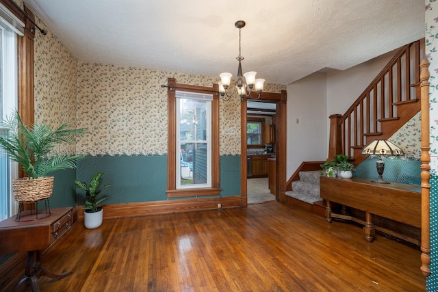 entryway featuring a chandelier and hardwood / wood-style flooring