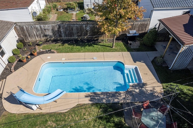 view of pool featuring a patio and a water slide