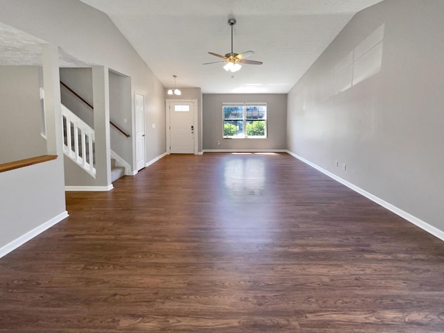 unfurnished living room with ceiling fan, dark hardwood / wood-style flooring, and vaulted ceiling