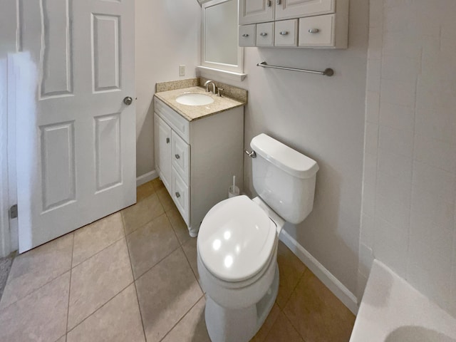 bathroom featuring tile patterned floors, vanity, and toilet