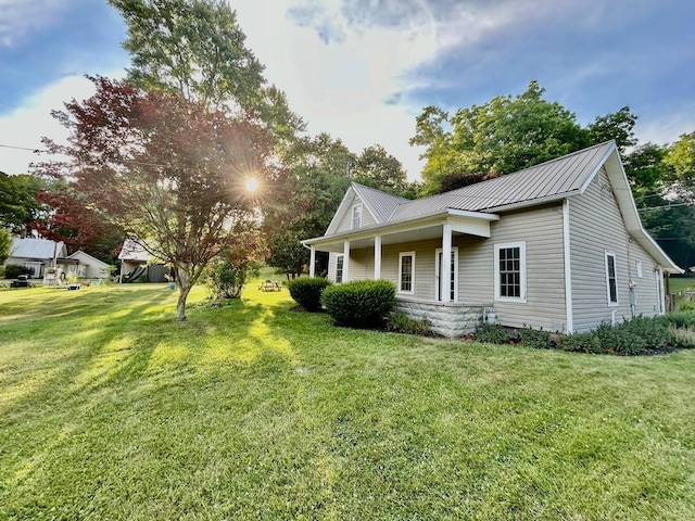 exterior space with a front yard and a porch