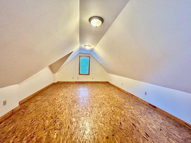 bonus room with vaulted ceiling