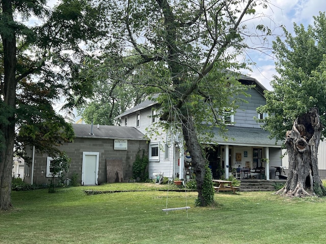 rear view of house with a lawn