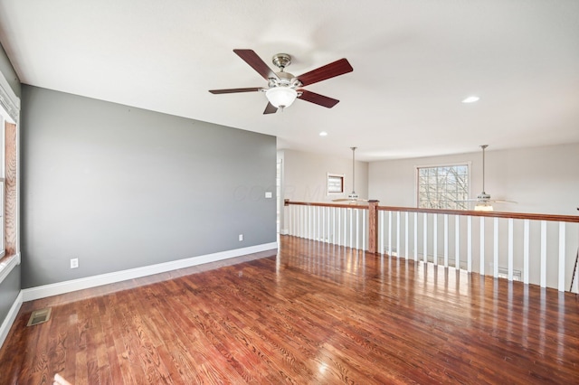 unfurnished room featuring ceiling fan and wood-type flooring