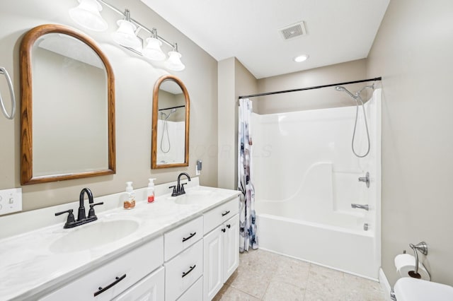 bathroom featuring tile patterned floors, vanity, and shower / tub combo