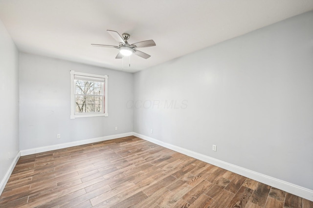 spare room with ceiling fan and hardwood / wood-style floors