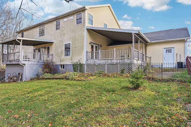 back of house with a lawn