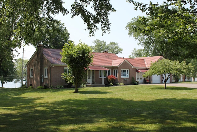 ranch-style house with a front yard and a garage