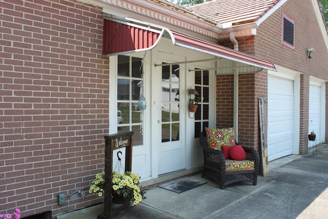 view of exterior entry featuring a garage