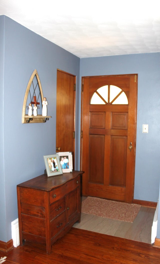 entrance foyer featuring dark hardwood / wood-style floors