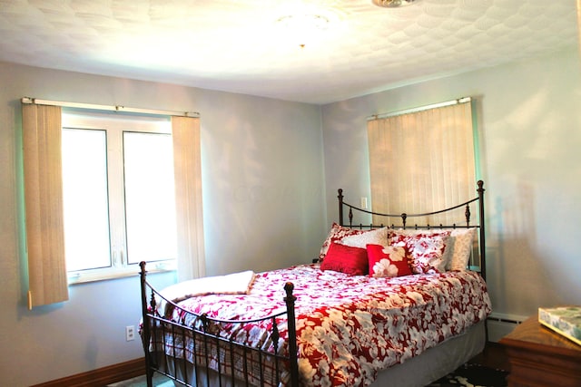 bedroom featuring a baseboard radiator