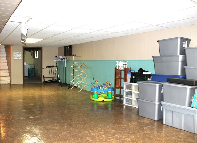 basement featuring a paneled ceiling