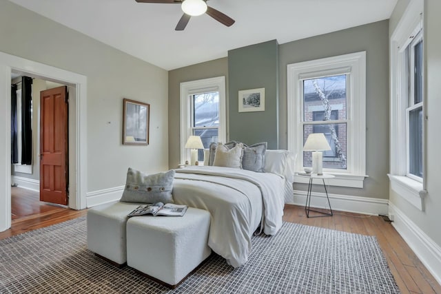 bedroom with hardwood / wood-style flooring and ceiling fan