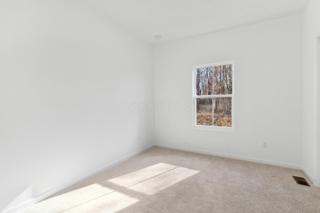 unfurnished room featuring carpet flooring