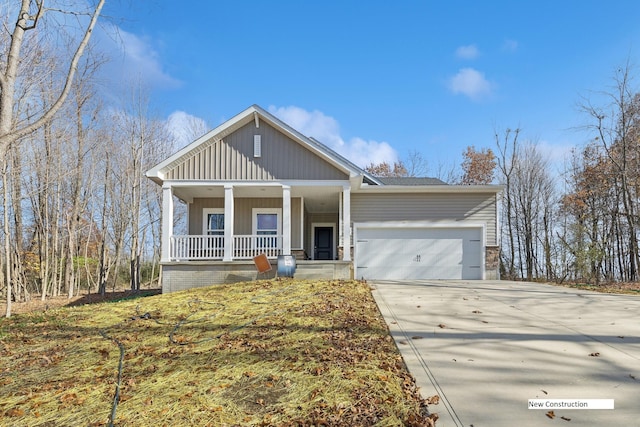 view of front facade with covered porch and a garage