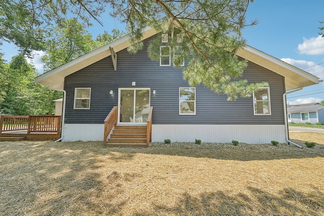 back of house with a wooden deck