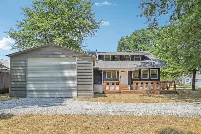 view of front of property featuring an outdoor structure and a garage