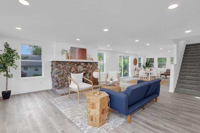 living room featuring a fireplace and light hardwood / wood-style floors