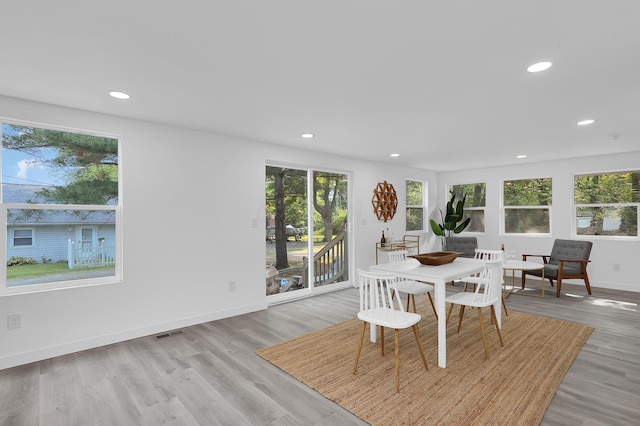 dining space featuring light wood-type flooring