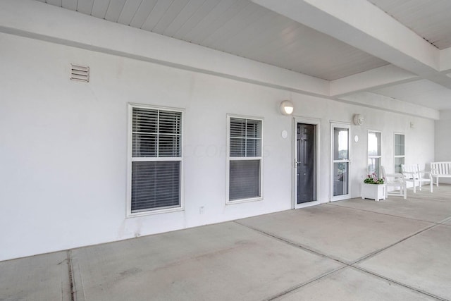 doorway to property featuring a patio