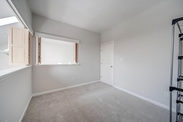 empty room with light colored carpet